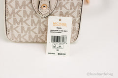 Michael Kors Travel XS Light Cream Signature PVC Duffle Crossbody Handbag